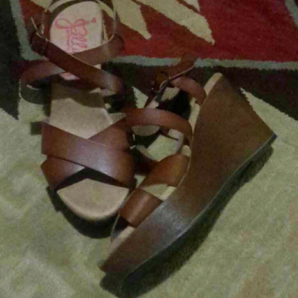 Size 8.5 Brown wedge leather sandals